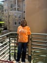 Abigail smiling on campus at Pitzer College
