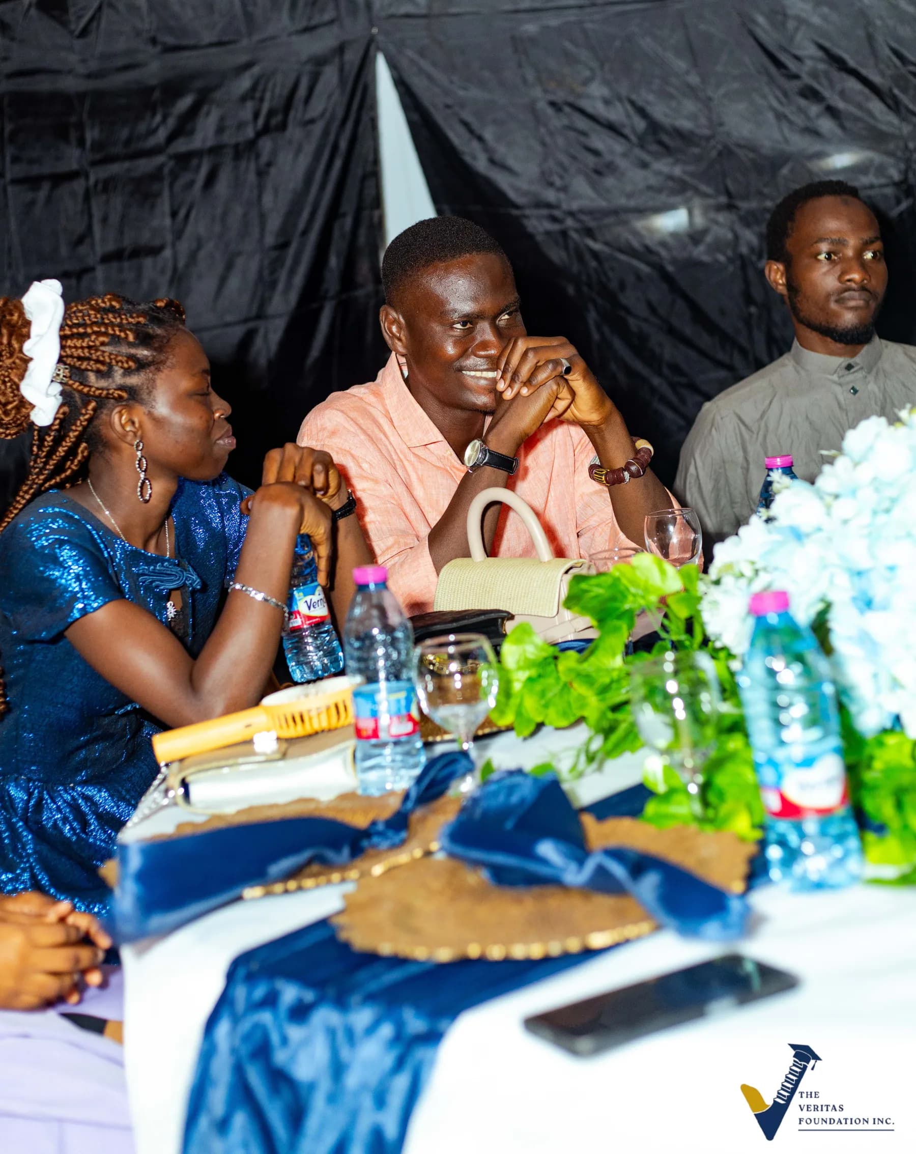 Guests seated at a decorated table during the Veritas dinner
